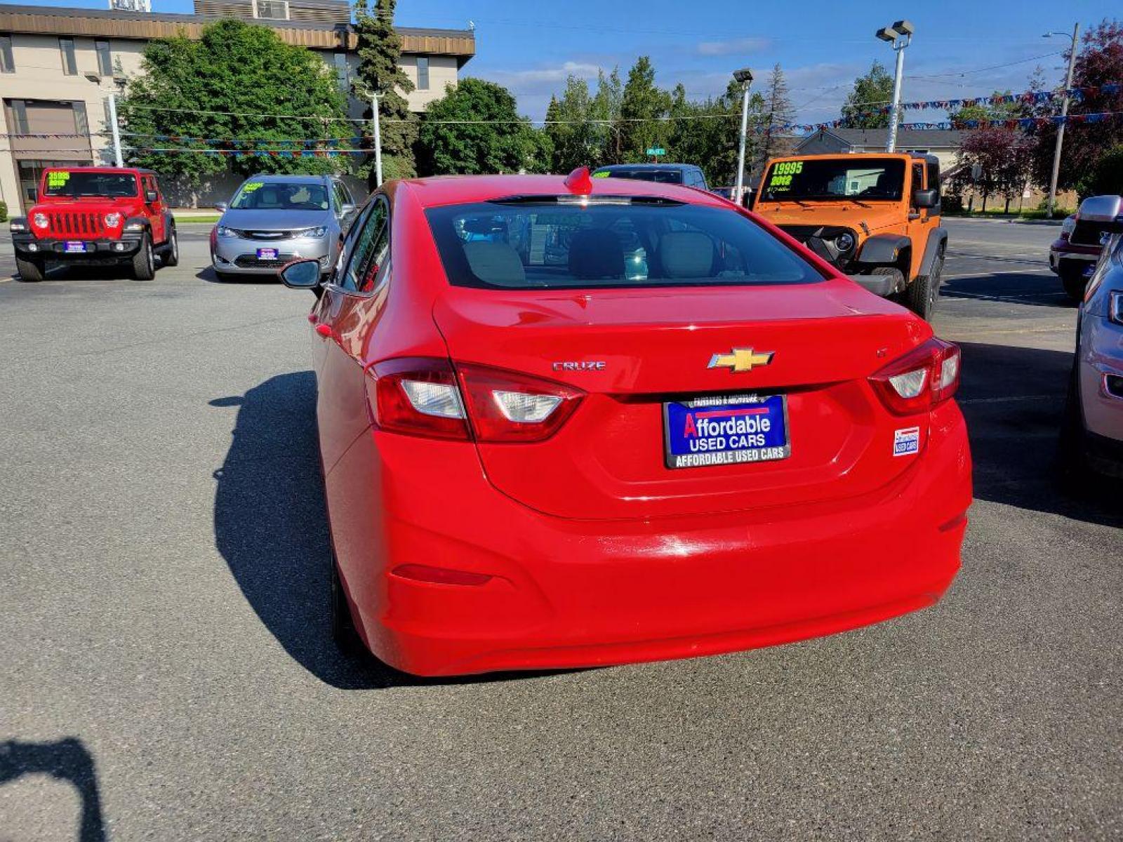2018 RED CHEVROLET CRUZE LT (1G1BE5SM9J7) with an 1.4L engine, Automatic transmission, located at 929 East 8th Ave, Anchorage, AK, 99501, (907) 274-2277, 61.214783, -149.866074 - Photo #2