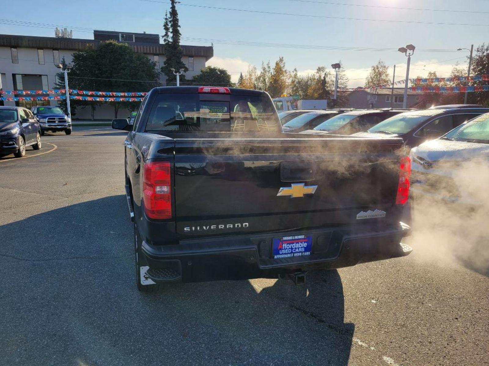 2015 BLACK CHEVROLET SILVERADO 1500 HIGH COUNTRY (3GCUKTEC6FG) with an 5.3L engine, Automatic transmission, located at 929 East 8th Ave, Anchorage, AK, 99501, (907) 274-2277, 61.214783, -149.866074 - Photo #2